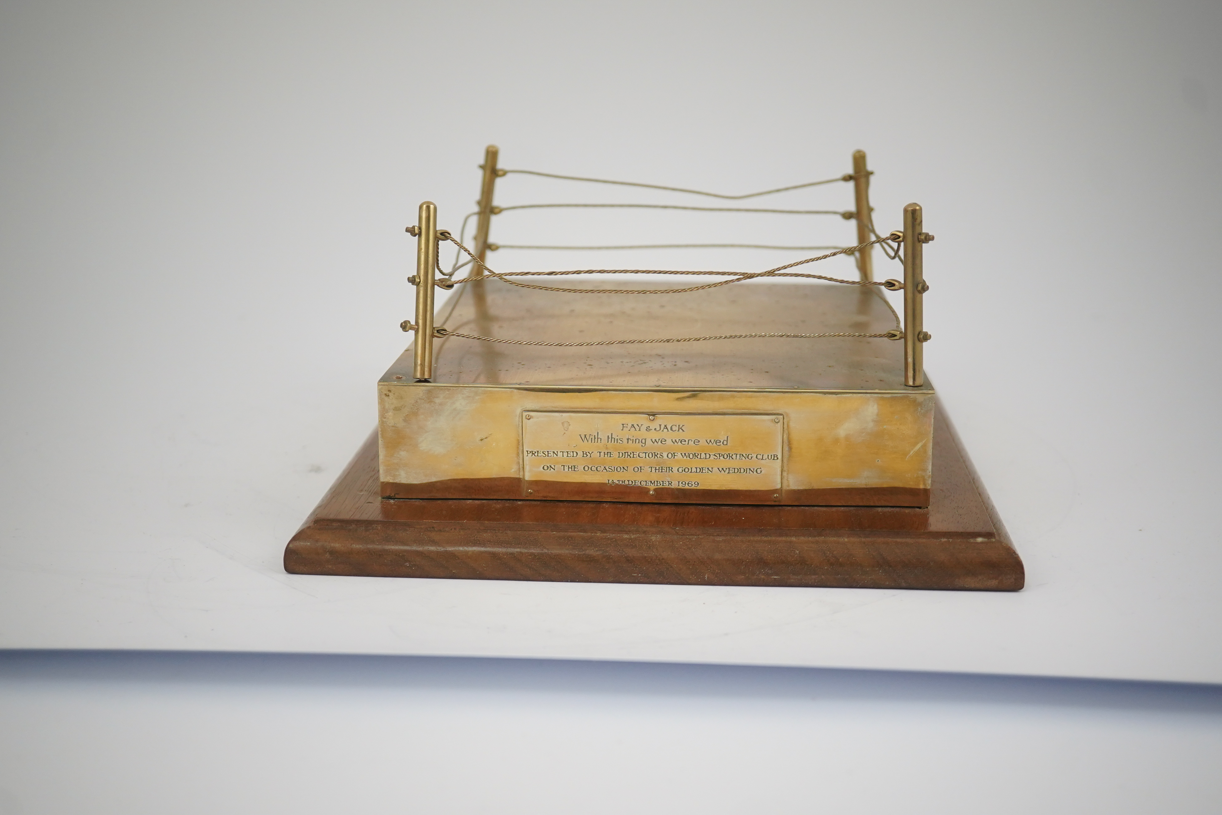 A late 1960's 9ct gold mounted Golden Wedding gift, presented to Jack & Fay Solomons from the Directors of World Sporting Club, modelled as a boxing ring